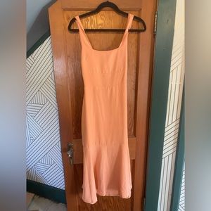 Beautiful light orange dress. Open tie back